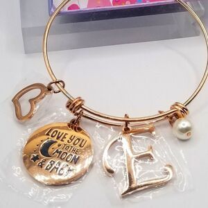 Gold toned charm bangle cuff Adustible bracelet Initial letter E.